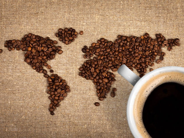 Colombian coffee beans map and coffee cup.